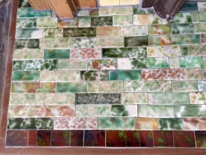 Crazy quilt of reclaimed tile in the hearth pad