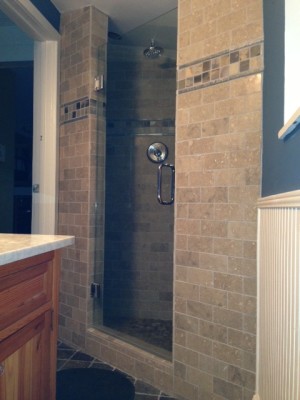 Limestone shower with slate accents